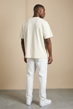 Different model wearing the boxy-fit tee, plain back view